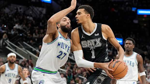 Jan 27, 2024; San Antonio, Texas, USA; San Antonio Spurs forward Victor Wembanyama (1) drives to the basket against the Minnesota Timberwolves center Rudy Gobert (27) during the first half at Frost Bank Center.